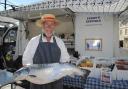 Ken Langley, of Ken’s Fresh Fish, with a Shetland salmon at Melksham Market Photo: Trevor Porter 66916-1