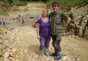 Neville (right) and Sally Hollingworth pose for a photograph during a dig in a quarry in the north Cotswolds. (PA)