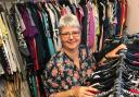 Trust chair Tracy Waldron prepares clothes for the end-of-summer sale at the Bath Road shop. Photo: Justin Guy
