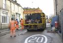 Contractors paint yellow lines on St Margaret’s Street as they prepare to open the much-delayed road over rail bridge in Bradford on Avon.