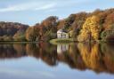 Looking across the lake towards the Pantheon with autumn colours, at Stourhead, Wiltshire