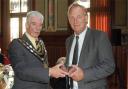 Trowbridge mayor John Knight presents an official gift to the people of Leer