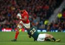 Wales' Taulupe Faletau (left) looks to break through the tackle of South Africa's Jan Serfontein during the Rugby World Cup game at Twickenham Stadium, London..