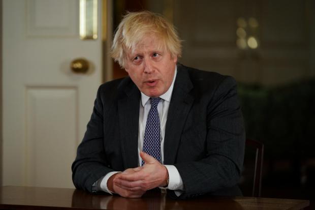Wiltshire Times: Prime Minister Boris Johnson, gestures as he records an address to the nation at Downing Street, London, to provide an update on the booster vaccine programme. See PA story HEALTH Coronavirus. Photo credit should read: Kirsty O'Connor/PA Wire.