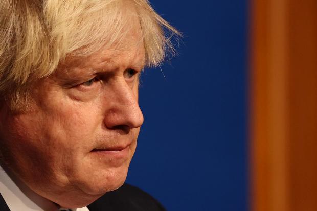 Wiltshire Times: Prime Minister Boris Johnson speaking at a press conference in London's Downing Street after ministers met to consider imposing new restrictions in response to rising cases and the spread of the Omicron variant. Picture date: Wednesday December 8,