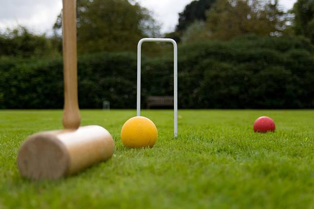 Playing croquet on an English lawn