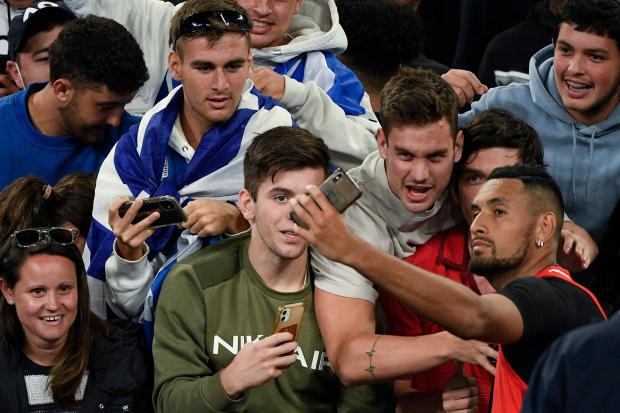 Nick Kyrgios takes a selfie with fans