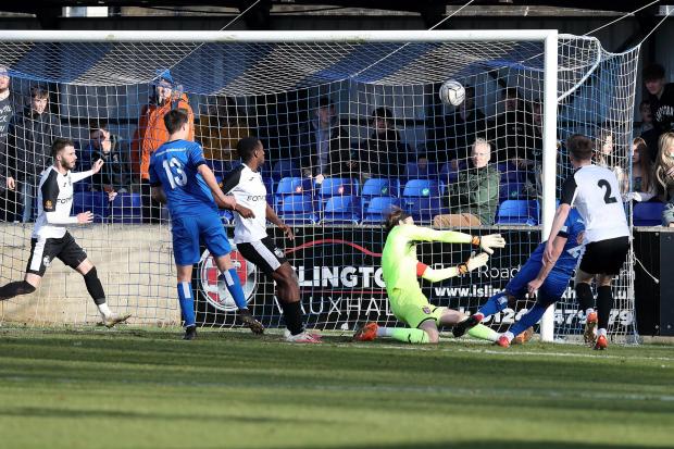 Chippenham Town loanee Harrison Minturn scores his side’s only goal of the game during the 1-1 draw with Hampton & Richmond Borough Photo: Richard Chappell