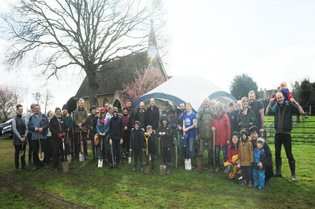 Armed with spades church goers and villagers turned out at the Beanacre Cricket Field to rewild the recreation area with the planting of scores of trees for the Queens Canopy project. Photo: Trevor Porter 67911-2