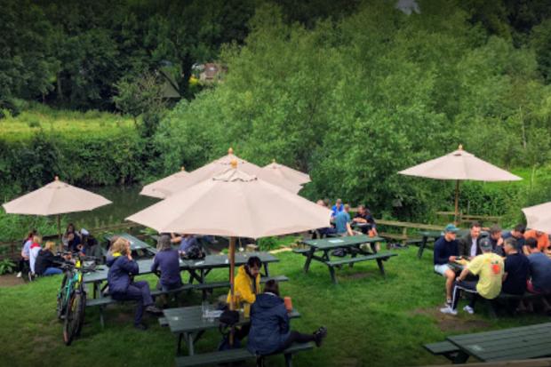 The beer garden at the Cross Guns, Avoncliff, overlooking the River Avon. Photo: Thomas Coombs