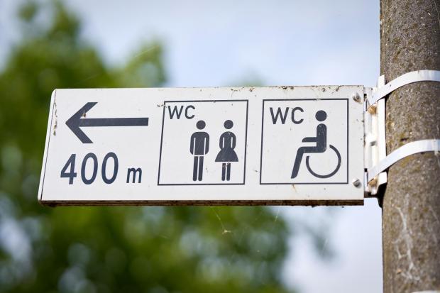 Three teenagers were arrested after public toilets were set on fire