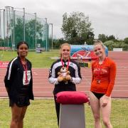 Wiltshire’s Jenna Blundell (Centre) receiving her gold medal at the England Athletics Under 23-20 Championships in Bedford last weekend