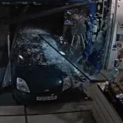 The car smashing through the doors at Boots