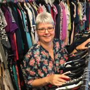 Trust chair Tracy Waldron prepares clothes for the end-of-summer sale at the Bath Road shop. Photo: Justin Guy