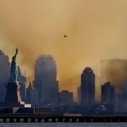 The Statue of Liberty is seen near the smoke coming from the remains of the World Trade Center. Photo: REUTERS/Ray Stubblebine