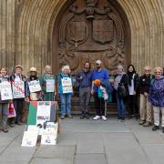 The Bradford on Avon Friends of Palestine members gather outside Bath Abbey before setting off