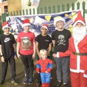 Oliver Brooking (right) with four of his friends took part in the Rudolph & Santa Fun Run in Trowbridge to raise funds for Wiltshire Air Ambulance. Photo: Trevor Porter 69421 -14