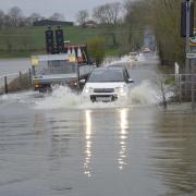 Drivers on the flooded B3105 at Staverton at 7am on Sunday. Photo: Trevor Porter 69732-4