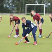 Team Gb and England Hockey player Tess Howard leads a coaching session at a school hockey club in 2019 PIcture: Stuart Walker