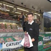 Troy Catley with butcher  Brett Halcat and  the wholesale meat venture with their custom-built lorry.
