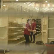 Staff clearing what's left of the stock on shelves at Wilko in Trowbridge