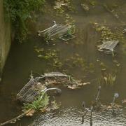Supermarket trolleys from the nearby Asda store have been dumped in the River Biss.