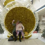 Loila Cickson and daughter Matilda sit in the giant glitter ball to take a selfie. Photo: Trevor Porter 70393-4