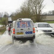 The scene early on Friday afternoon with the B3105 causeway at Staverton under water.