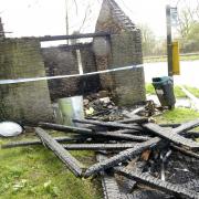 A fire that is believed to have been started deliberately has gutted a bus shelter used as a temporary home by a homeless person