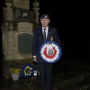 Former RAF air crash rescue fireman Julian Derrick with the Royal Canadian Air force wreath to lay at the Bradford on Avon War Memorial in Westbury Gardens to commemorate Halifax bomber crashing in Bradford on Avon.