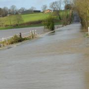 Police have closed part of the B3105 at Staverton due to flooding