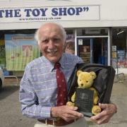 Toy shop owner Clive Brown with his national ‘Golden Teddy’ and glass plaque outside his Trowbridge shop.
