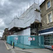 The latest plans propose it be replaced by a shop, eight two-bedroom flats and three one-bedroom flats.