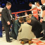 Nick Blackwell is tended to after collapsing following his defeat to Chris Eubank Jr last night (Picture: Trevor Porter)