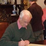 Glyn Bridges signs the charter between Trowbridge Museum and Leer Heimat-museum