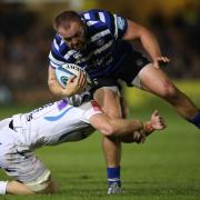 Bath's Tom Dunn is tackled by Exeter Chiefs' Matt Kvesic
