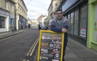 Enterprising  shop owner David Carradus approached traders in Silver Street, Trowbridge, for their logos and produced a sign to promote more trade. Photo: Trevor Porter 69372-1