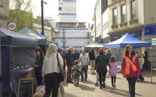 The busy Trowbridge Weavers Market in Fore Street with shoppers and stall holders enjoying the April sunshine.