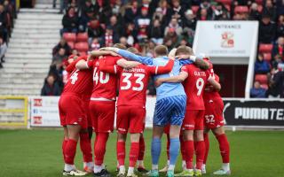 Swindon Town players in a huddle